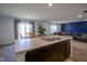 Open floor plan showcasing the kitchen island, sink, and connections to dining and living areas at 507 Redvine Dr, Sheridan, IN 46069