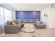Comfortable living room with a large gray sectional, stylish coffee table, and a pop of color at 507 Redvine Dr, Sheridan, IN 46069
