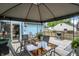 Spacious outdoor dining area under a gazebo with blue house in the background at 5821 Pemberly Dr, Indianapolis, IN 46221