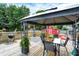 Backyard deck featuring a patio, dining area, and red barn, perfect for outdoor living at 5821 Pemberly Dr, Indianapolis, IN 46221