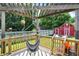 View from deck with hammock looking onto backyard red barn and slide at 5821 Pemberly Dr, Indianapolis, IN 46221