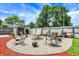 Backyard fire pit area with seating, storage shed and wood privacy fence at 5821 Pemberly Dr, Indianapolis, IN 46221