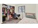 A well-organized bedroom featuring a twin bed, closet and desk at 5821 Pemberly Dr, Indianapolis, IN 46221