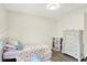 Well-lit bedroom featuring a twin bed, closet and chest of drawers at 5821 Pemberly Dr, Indianapolis, IN 46221