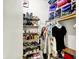 Organized walk-in closet showcasing ample storage for shoes, clothes, and accessories at 5821 Pemberly Dr, Indianapolis, IN 46221