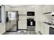 Bright kitchen with stainless steel appliances and white cabinets at 5821 Pemberly Dr, Indianapolis, IN 46221