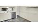 The kitchen has stainless steel appliances, white cabinets, and updated fixtures at 5821 Pemberly Dr, Indianapolis, IN 46221