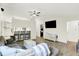 Bright living room featuring a ceiling fan, hardwood flooring, and comfortable seating arrangement at 5821 Pemberly Dr, Indianapolis, IN 46221