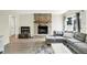 Comfortable living room with a stone fireplace, wood floors, and a gray sectional couch at 5821 Pemberly Dr, Indianapolis, IN 46221