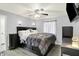 Spacious main bedroom featuring a ceiling fan, bedside lamps, and a large bed at 5821 Pemberly Dr, Indianapolis, IN 46221