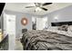 Well-lit main bedroom with ensuite bath and walk-in closet featuring a comfortable bed at 5821 Pemberly Dr, Indianapolis, IN 46221