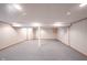 Finished basement with carpet, white walls, support beam, and utility door at 6028 Thornwood Ct, Indianapolis, IN 46250