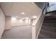 Finished basement with carpet and stairs leading to upper level at 6028 Thornwood Ct, Indianapolis, IN 46250