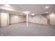 Finished basement with carpet, white walls, support beam, and access door at 6028 Thornwood Ct, Indianapolis, IN 46250