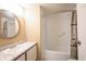 Bathroom with an oval mirror, vanity, and a shower-tub combo with curtain at 6028 Thornwood Ct, Indianapolis, IN 46250