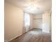 Bedroom with neutral carpet and paint, ceiling fan and a window with patterned curtains at 6028 Thornwood Ct, Indianapolis, IN 46250