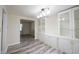 Dining room featuring built-in cabinets and modern flooring at 6028 Thornwood Ct, Indianapolis, IN 46250