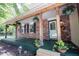 Front porch with brick facade, plants, and decorative accents at 6028 Thornwood Ct, Indianapolis, IN 46250