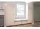 Kitchen window bench seat with white cabinets providing ample storage at 6028 Thornwood Ct, Indianapolis, IN 46250
