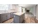 Bright kitchen with island, white subway tile backsplash, and stainless steel appliances at 6028 Thornwood Ct, Indianapolis, IN 46250