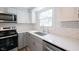 Close-up of kitchen featuring stainless steel appliances and white subway tile backsplash at 6028 Thornwood Ct, Indianapolis, IN 46250