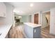 Spacious kitchen and open floor plan leading to a living room with a fireplace at 6028 Thornwood Ct, Indianapolis, IN 46250