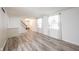 Bright living room featuring stylish flooring and a staircase at 6028 Thornwood Ct, Indianapolis, IN 46250