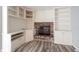 Close up of fireplace with brick surround and built-in shelving at 6028 Thornwood Ct, Indianapolis, IN 46250