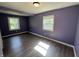 Bedroom with neutral paint, luxury vinyl flooring, and lots of natural light at 6238 E Southport Rd, Indianapolis, IN 46237