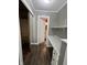 Hallway featuring built in desk, closet, and luxury vinyl flooring at 6238 E Southport Rd, Indianapolis, IN 46237