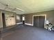 This is a spacious garage with painted walls, and a closet with a washer and dryer hookup at 6238 E Southport Rd, Indianapolis, IN 46237