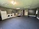 Finished garage with carpet, laundry area and utility sink at 6238 E Southport Rd, Indianapolis, IN 46237