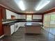 This modern kitchen features white cabinets, a center island, and stainless steel appliances at 6238 E Southport Rd, Indianapolis, IN 46237