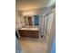 Bathroom featuring double sink vanity and shower with glass doors at 6504 Potomac Square Ln, Indianapolis, IN 46268