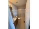 Full bathroom with single sink vanity and shower with glass doors at 6504 Potomac Square Ln, Indianapolis, IN 46268