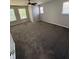 Large carpeted bedroom featuring ample natural light and a ceiling fan at 6504 Potomac Square Ln, Indianapolis, IN 46268