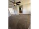 Bedroom with carpeted floor, ceiling fan, ensuite bathroom, and closet at 6504 Potomac Square Ln, Indianapolis, IN 46268