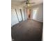 Carpeted bedroom featuring a ceiling fan, closet and an exterior door to the deck at 6504 Potomac Square Ln, Indianapolis, IN 46268