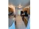 Functional kitchen featuring updated appliances, wooden cabinets, and tile flooring for easy maintenance at 6504 Potomac Square Ln, Indianapolis, IN 46268