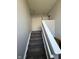 Carpeted stairway leading to an upper landing with closet and bedroom access at 6504 Potomac Square Ln, Indianapolis, IN 46268