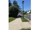 Peaceful neighborhood street featuring sidewalks, manicured lawns, and inviting homes along the way at 6504 Potomac Square Ln, Indianapolis, IN 46268