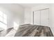 Bright bedroom with hardwood floors and double-door closet at 6592 Reserve Dr, Indianapolis, IN 46220