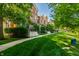 View of a row of townhouses surrounded by trees and lawn at 6592 Reserve Dr, Indianapolis, IN 46220