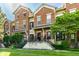 Brick townhouses featuring well-maintained exteriors and appealing landscaping at 6592 Reserve Dr, Indianapolis, IN 46220