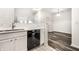 Kitchen details showcasing stainless steel faucet, black dishwasher and view to living room at 6592 Reserve Dr, Indianapolis, IN 46220