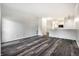 Spacious open-concept living room and kitchen featuring modern, wood-look floors at 6592 Reserve Dr, Indianapolis, IN 46220