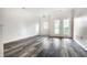 Spacious living room featuring modern wood-look flooring and neutral paint at 6592 Reserve Dr, Indianapolis, IN 46220