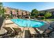 Exterior shot of a pool with lounge chairs in a townhouse community at 6592 Reserve Dr, Indianapolis, IN 46220