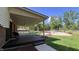 Inviting back porch with wooden deck overlooks a landscaped backyard and pergola at 6602 S 400 W, Columbus, IN 47201
