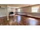 Finished basement with a brick fireplace, accent wall, laminate flooring and recessed lighting at 6602 S 400 W, Columbus, IN 47201